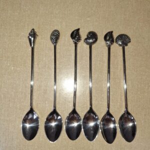 Schelpen theelepels en gebaksvorkjes
